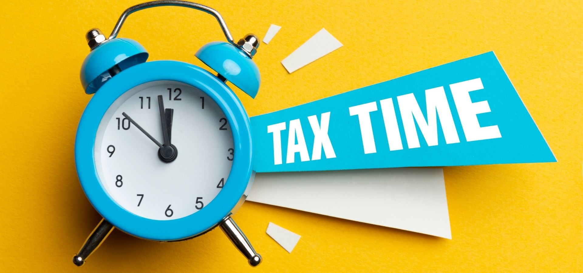 March Blog Tax Season Scams tax time image with clock